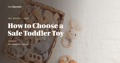 Neatly arranged natural wooden toddler toys beside the headline 'How to Choose a Safe Toddler Toy' — JuniSprouts guide to 2026 toy recalls and toy safety.