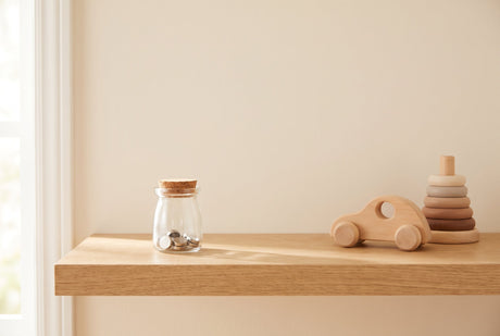 Small high-powered magnets sealed inside a closed jar kept out of a child’s reach, illustrating safe magnet storage