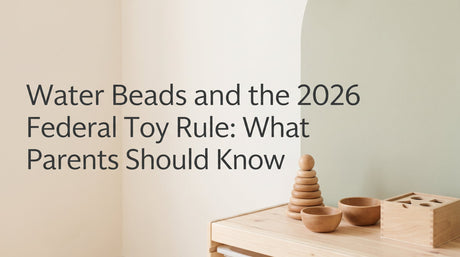 Wooden Montessori toddler toys on a warm cream background illustrating the 2026 federal water bead toy safety rule for parents