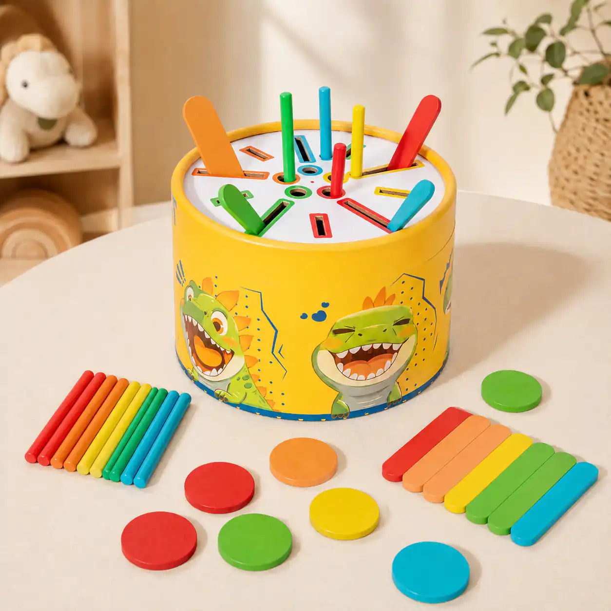Rainbow wooden discs included in the dinosaur color sorting drum set