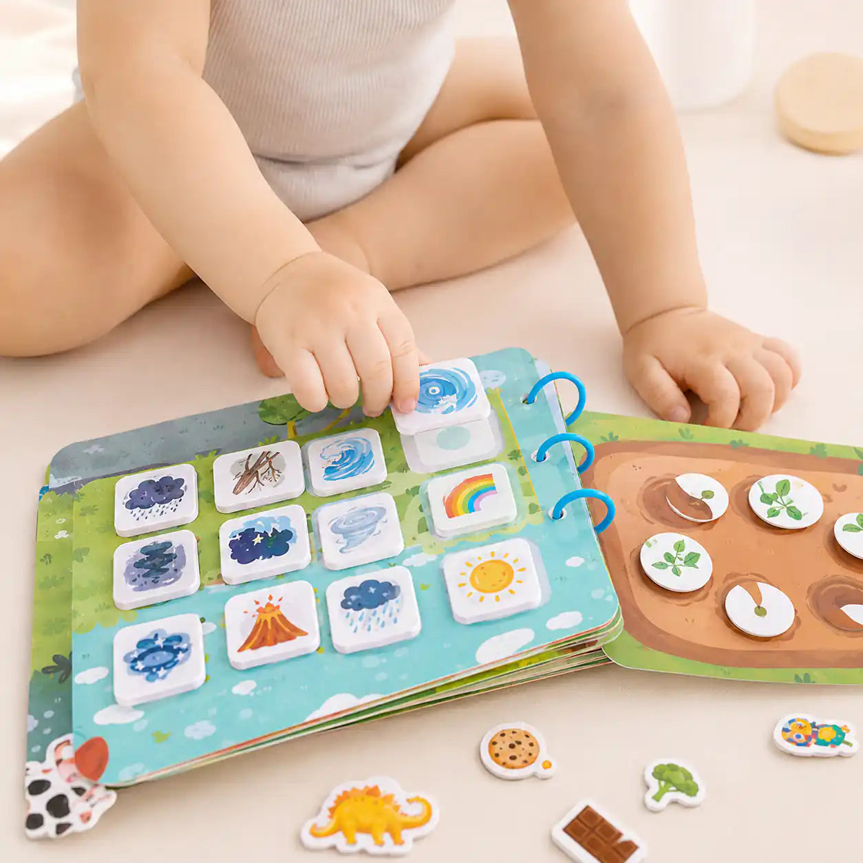 Montessori busy book set beside a ruler showing size and scale