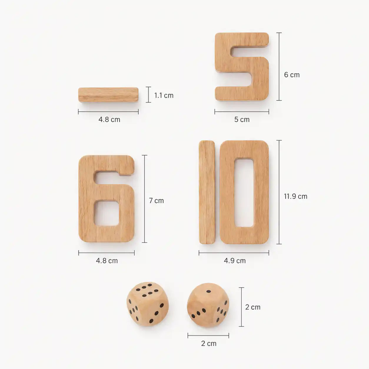 Toddler girl smiling as she places a small wooden number block onto a tall stack of natural beech wood Montessori number blocks