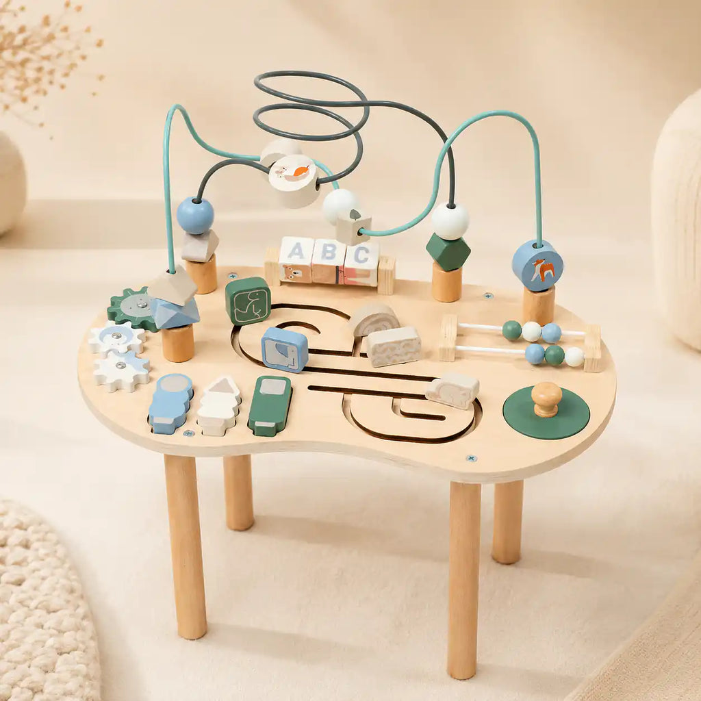 Wooden 10-in-1 Montessori activity table with bead maze, spinning gears, ABC blocks, mini abacus, and animal sliders on cream background
