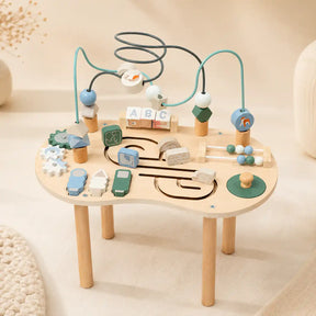 Wooden 10-in-1 Montessori activity table with bead maze, spinning gears, ABC blocks, mini abacus, and animal sliders on cream background