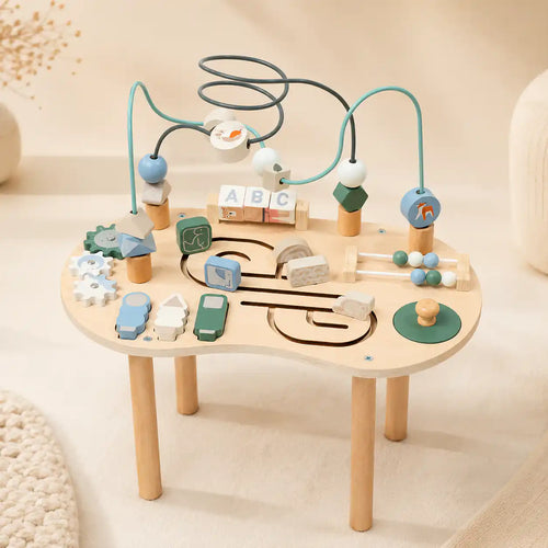 Wooden 10-in-1 Montessori activity table with bead maze, spinning gears, ABC blocks, mini abacus, and animal sliders on cream background