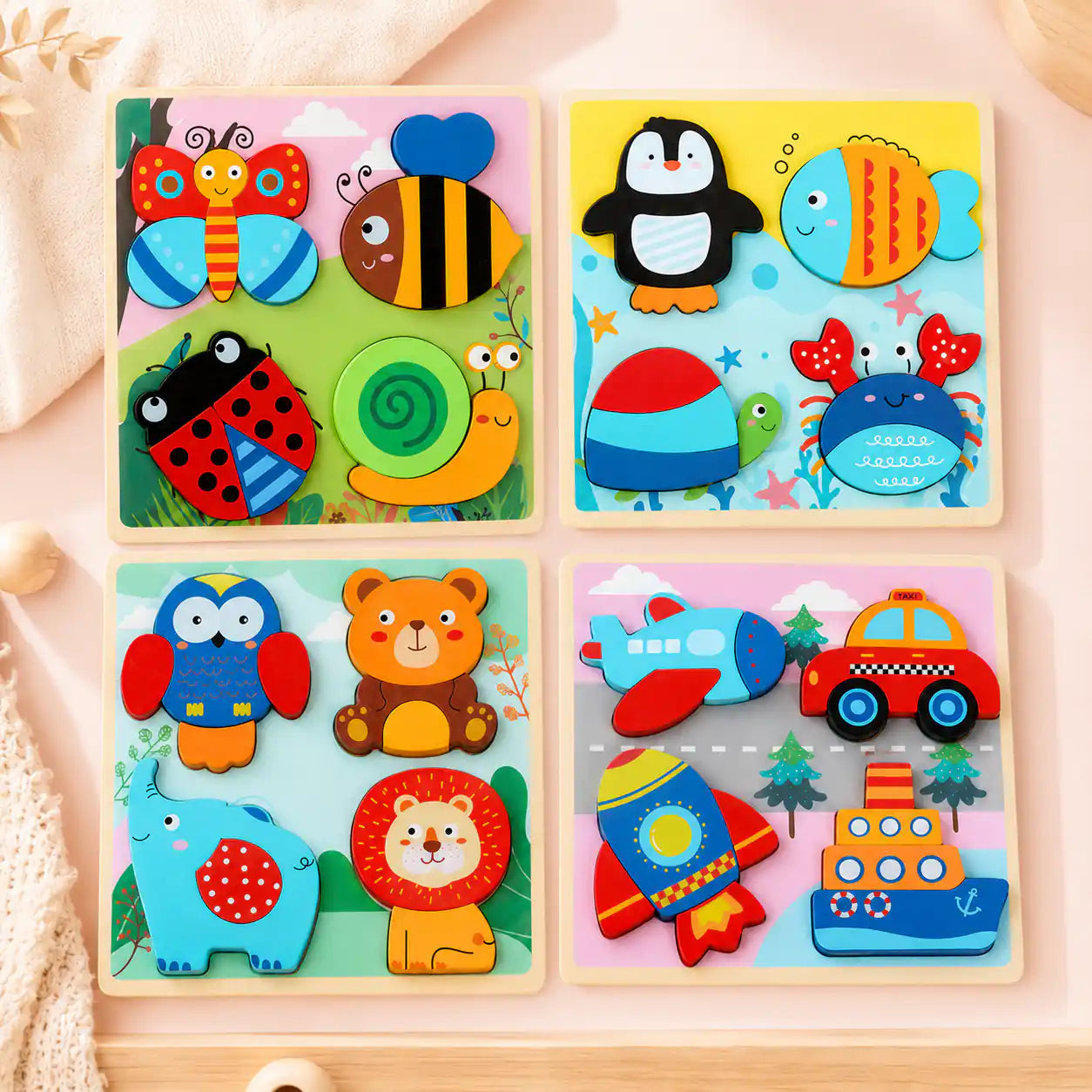 Flat-lay of the 4-pack wooden chunky puzzle set with garden bugs, ocean animals, forest friends, and vehicles puzzles for toddlers