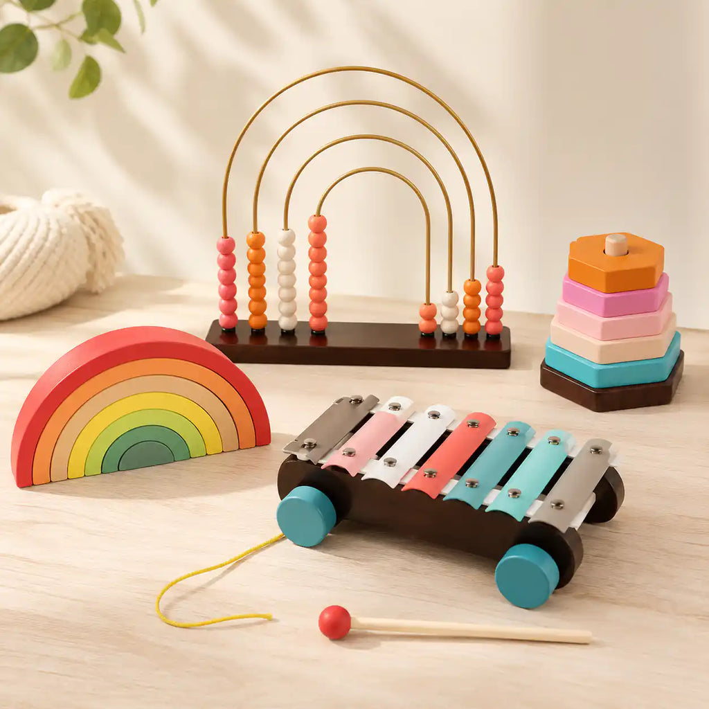 Wooden counting abacus with 4 golden arches and coral, pink, cream, and orange wooden beads on a dark wood base