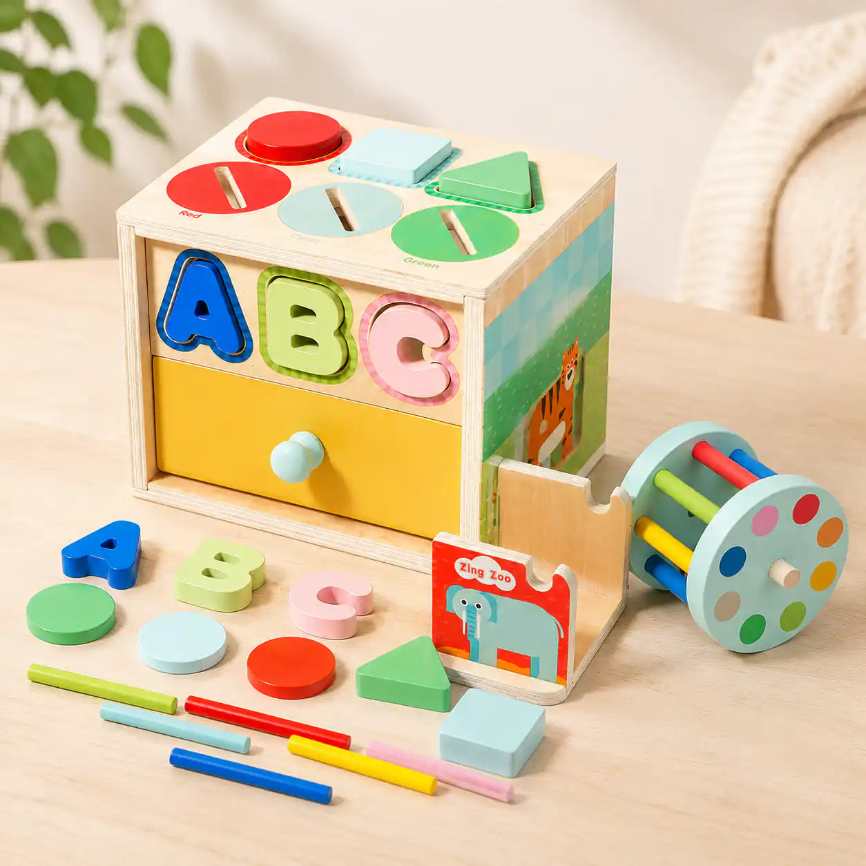 Wooden 6-in-1 activity cube with detachable rainbow drum and slide-out Zing Zoo elephant puzzle card