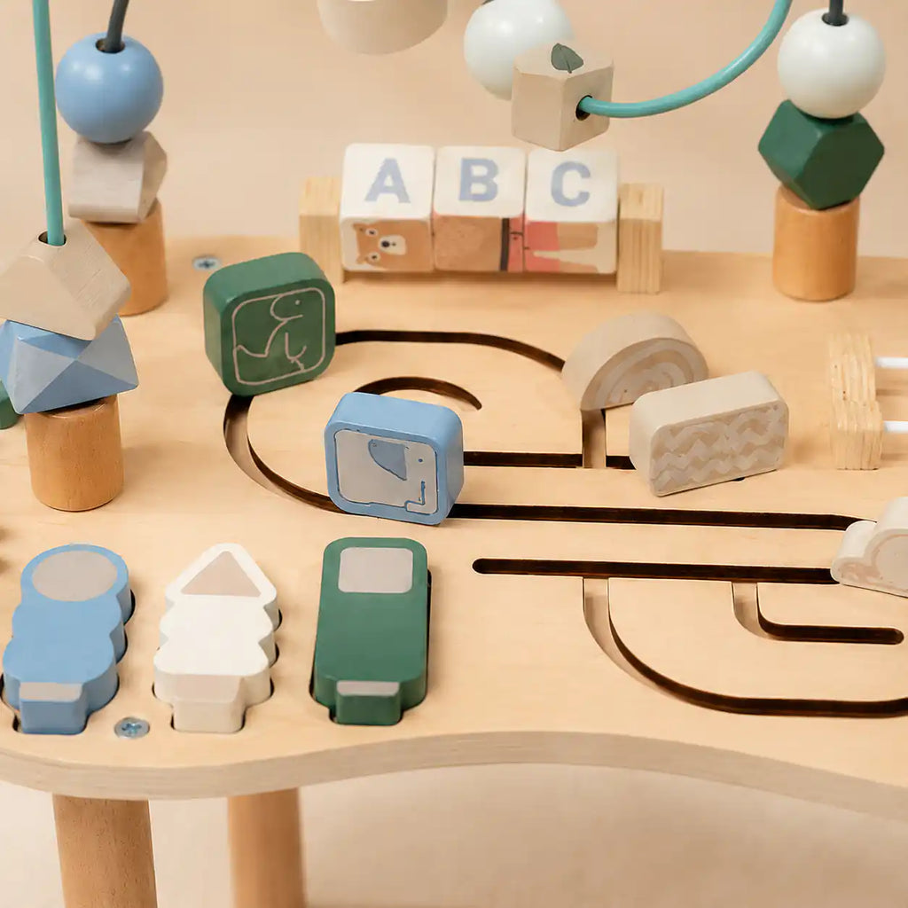Wooden Montessori table close-up of rotating ABC blocks for early alphabet recognition and fine motor play