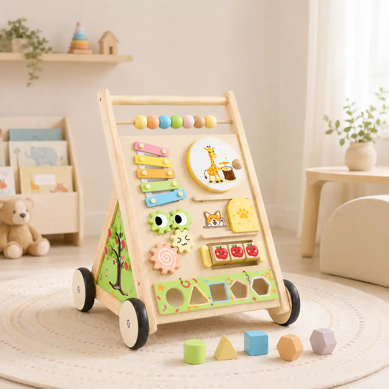 Side view of wooden Montessori push walker showing magnifying viewer, rainbow slider, apple rollers, and sturdy wooden wheels for ages 1+