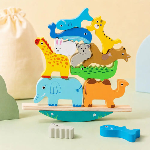 Wooden animal balancing stacker toy with ten chunky wooden animals assembled into a Montessori tower on a cream background