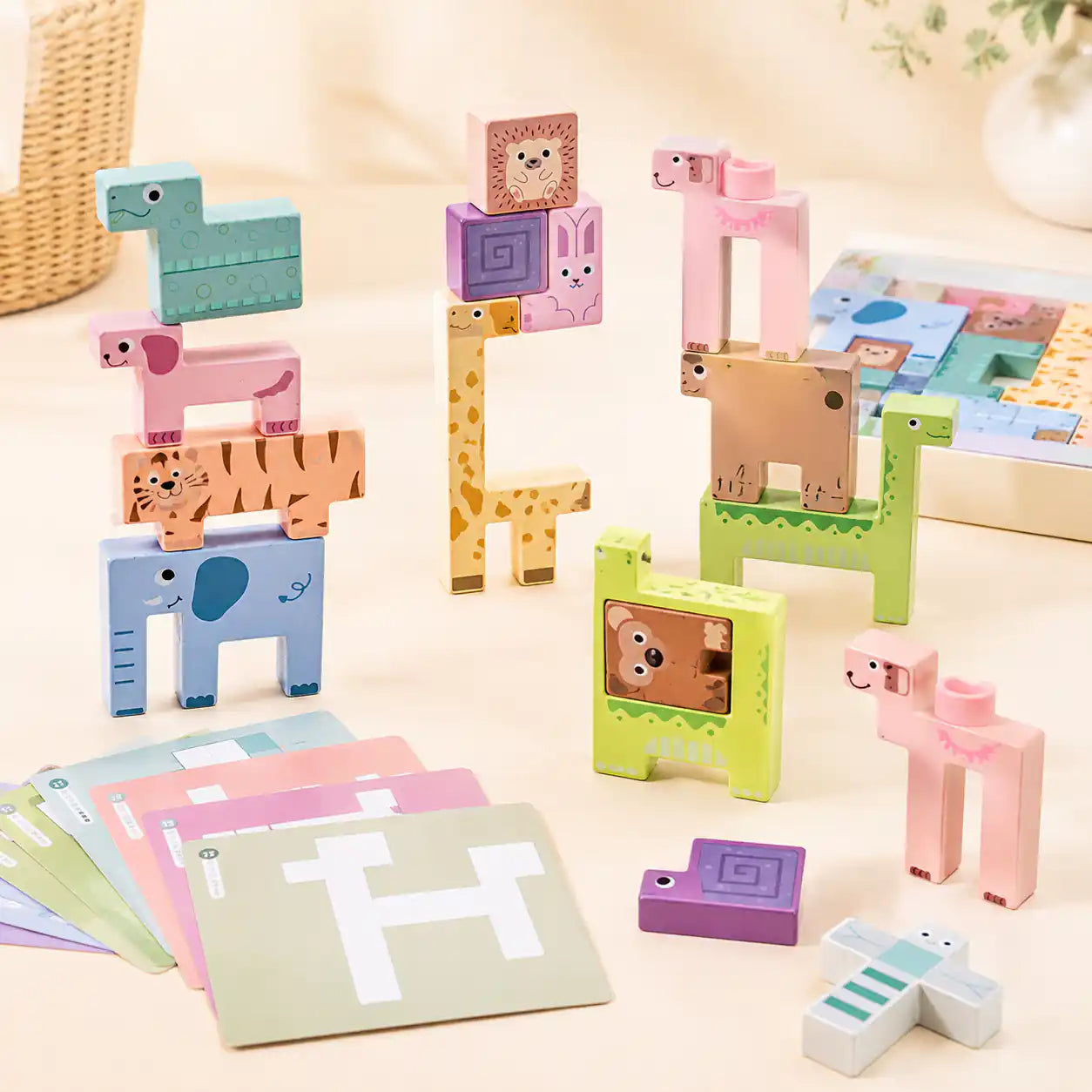 Small hands assembling the wooden animal puzzle stacker piece by piece on a warm neutral surface