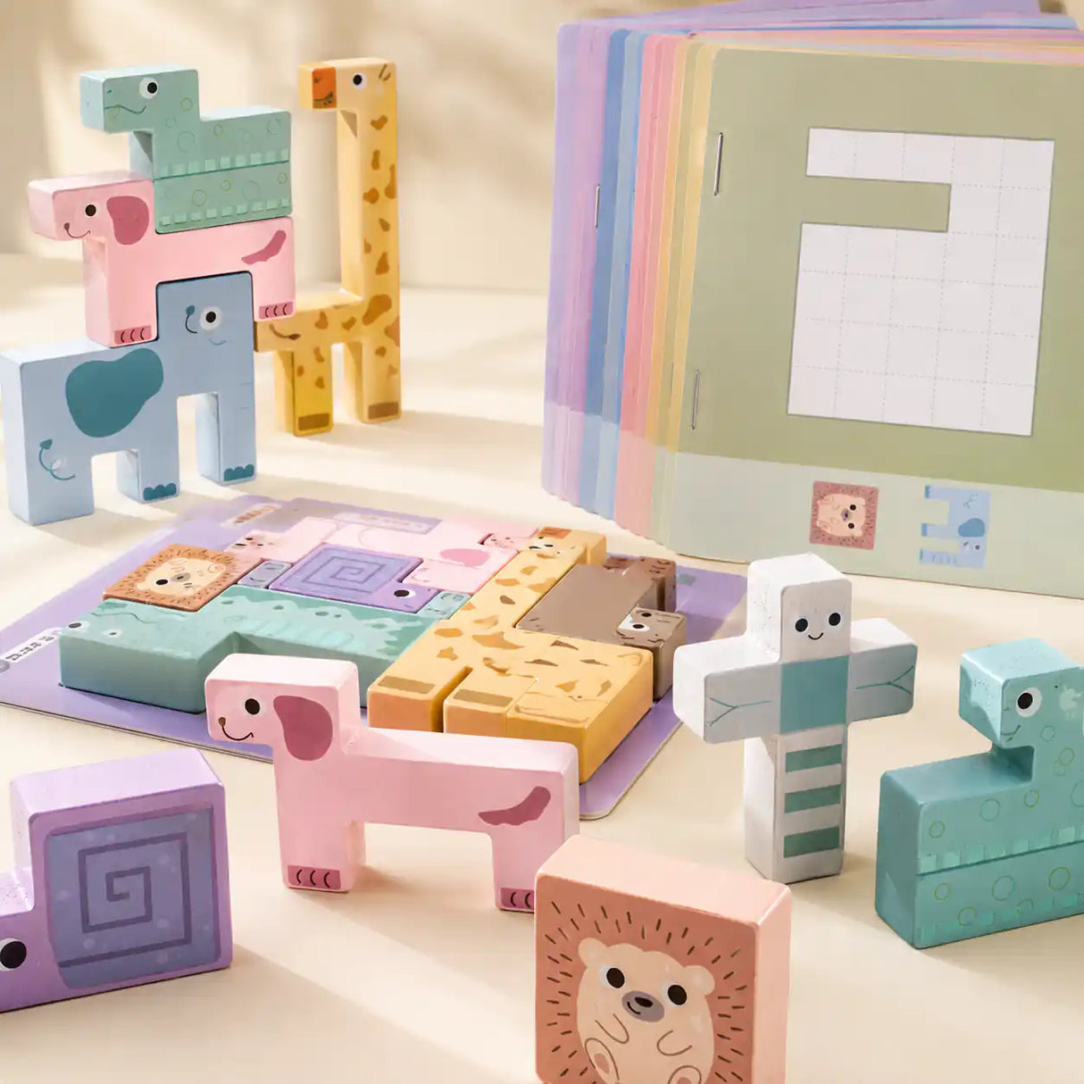 Flat lay of all wooden animal puzzle stacker pieces arranged in order showing each animal
