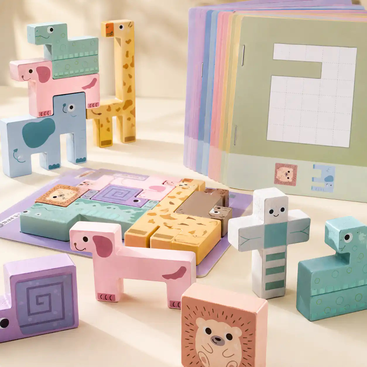 Flat lay of all wooden animal puzzle stacker pieces arranged in order showing each animal