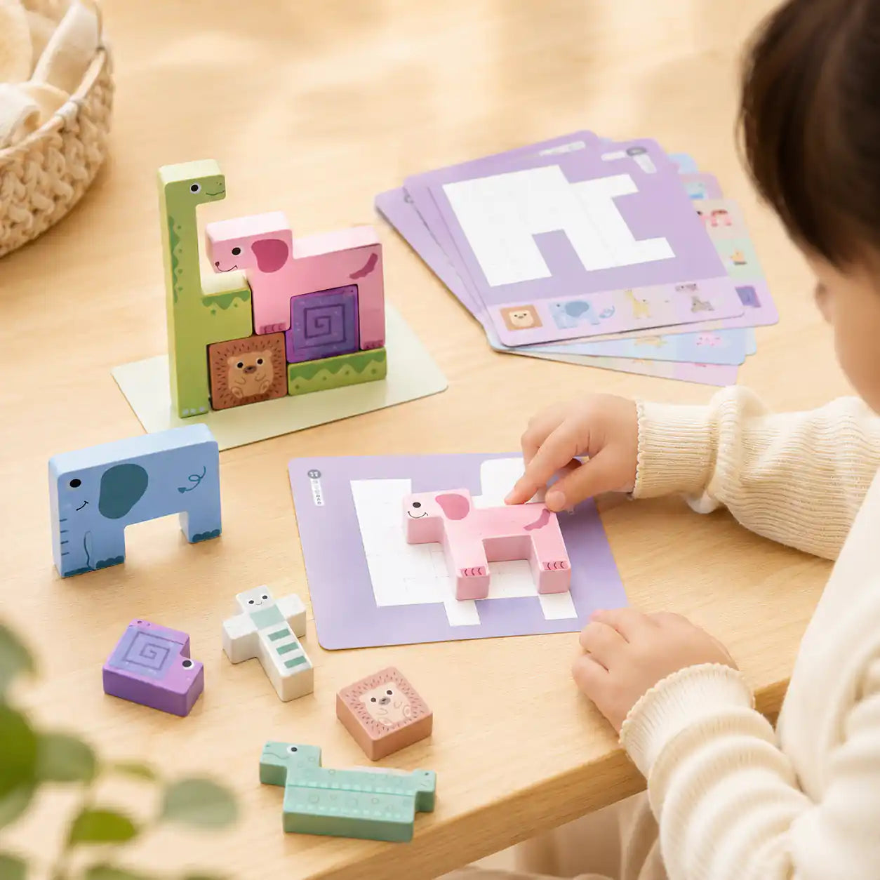 Wooden animal puzzle stacker beside a ruler and tape measure showing size and scale