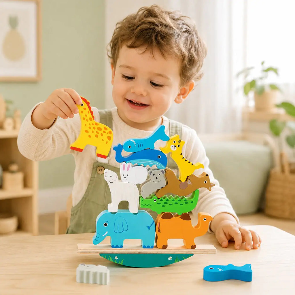 Toddler hands stacking wooden animal pieces on the balancing stacker for fine motor play