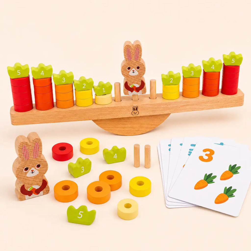 Wooden bunny balance scale Montessori counting toy with stacking carrot discs on a cream background