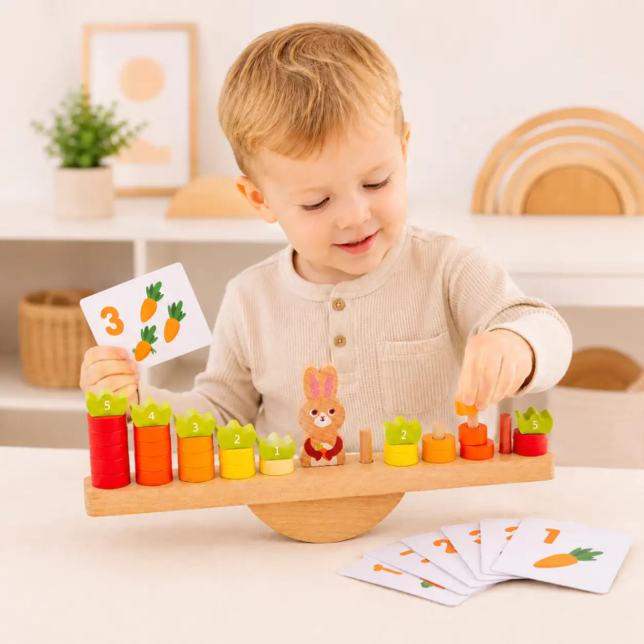 Included number flashcards with digits and number words shown beside the bunny balance scale