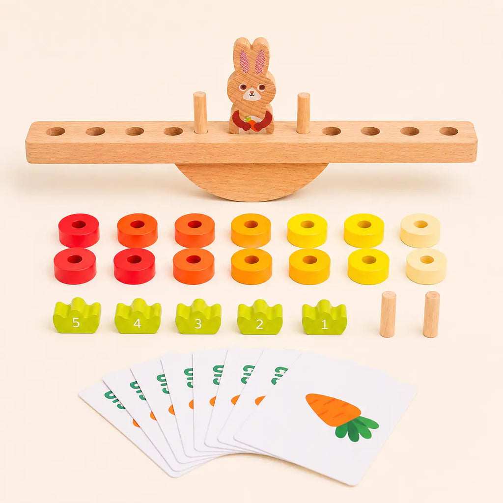 Toddler hands stacking wooden carrot discs onto the bunny balance scale pegs