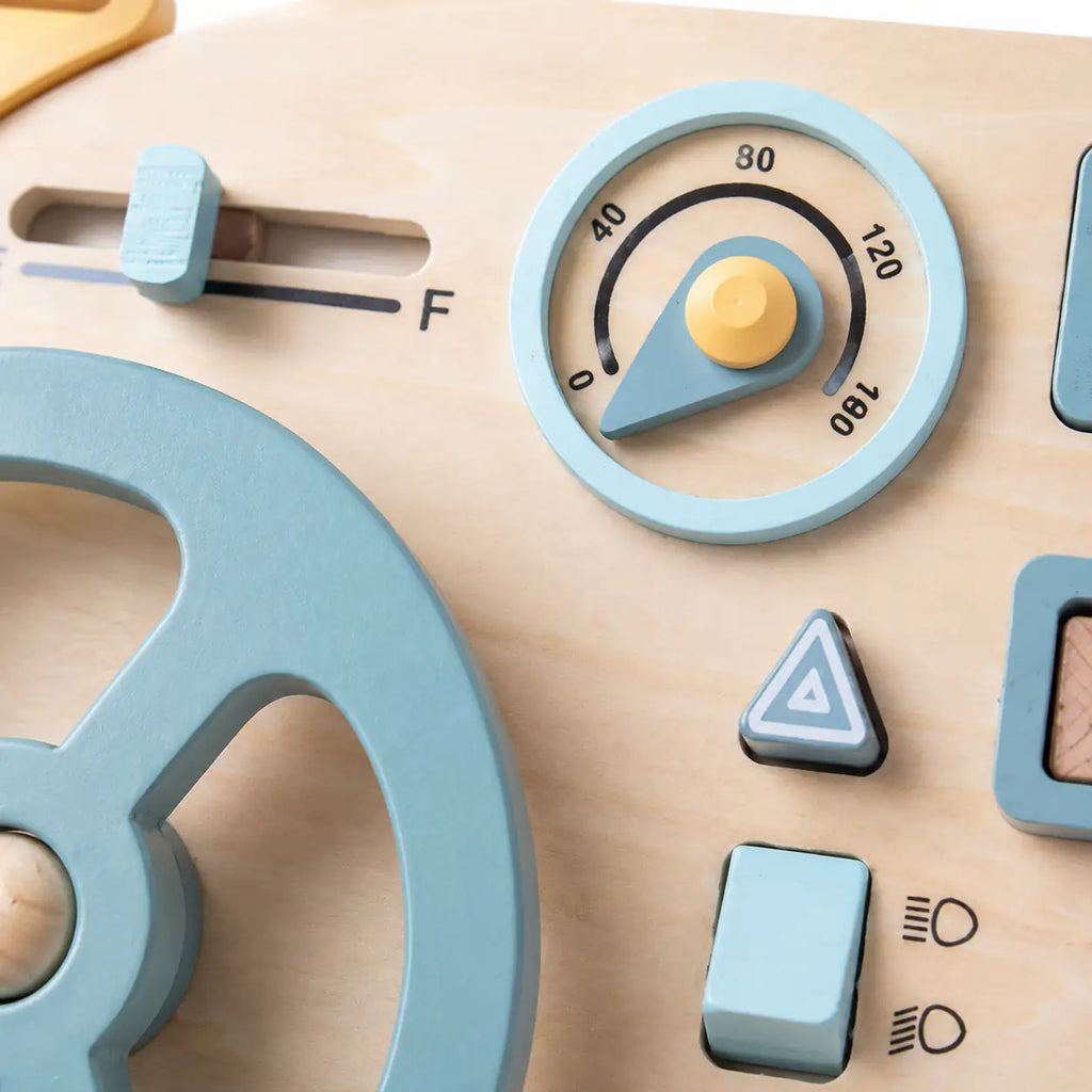 Close-up of the wooden steering wheel, ignition key and metal latch glove box on the busy board mini