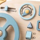 Close-up of the wooden steering wheel, ignition key and metal latch glove box on the busy board mini