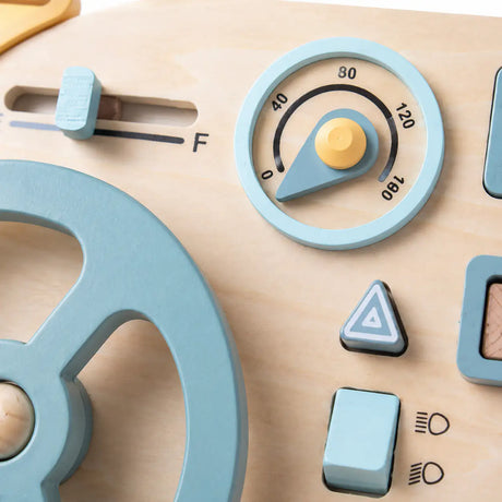 Close-up of the wooden steering wheel, ignition key and metal latch glove box on the busy board mini