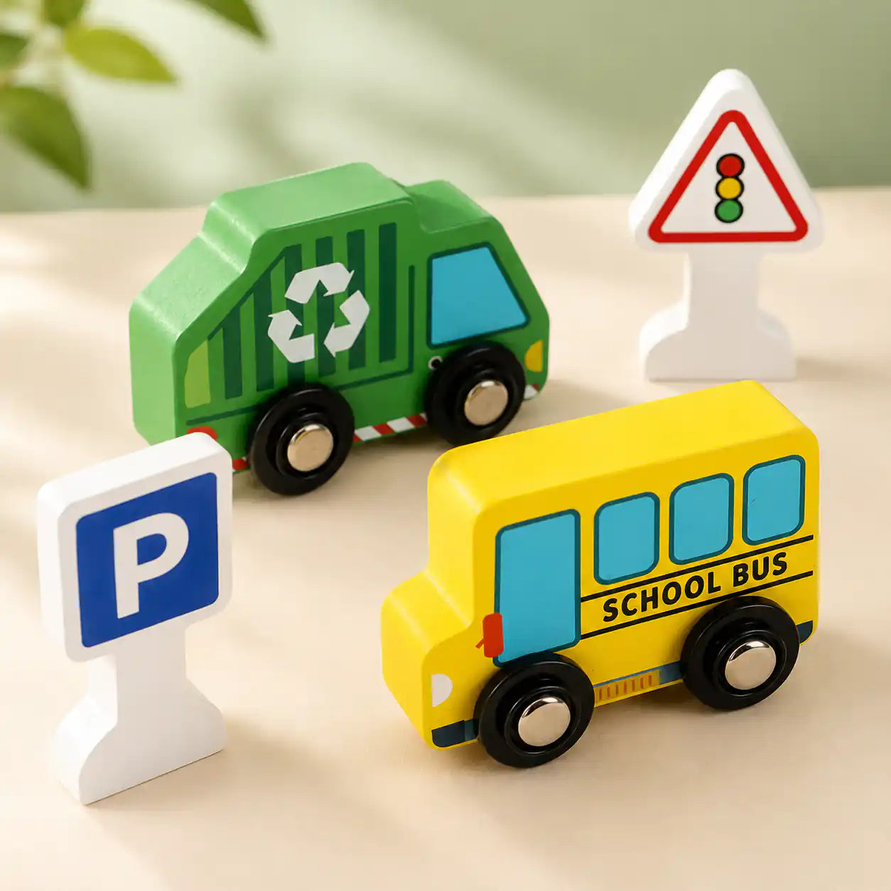 Angled view of the wooden city traffic play set with vehicles and signs arranged on the printed city play mat