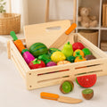 Wooden cutting fruits and vegetables play set with 17 pieces and wooden crate on a cream background