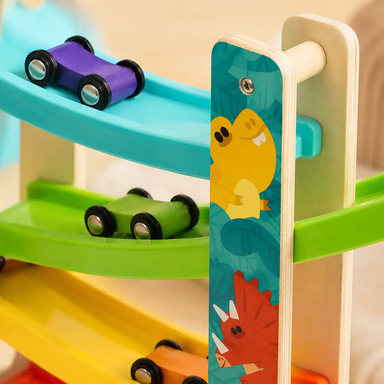 Mini wooden car zigzagging down the tracks of the dinosaur ramp racer