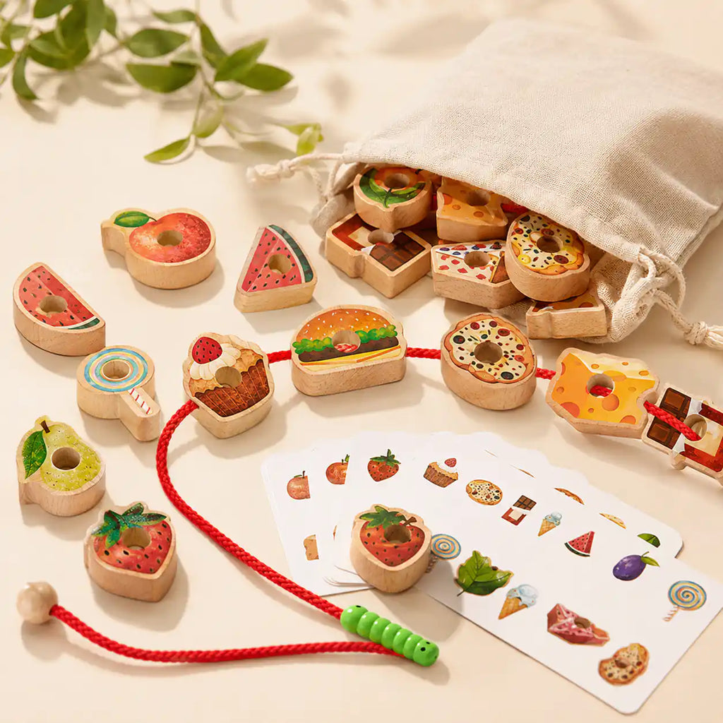 Wooden food lacing set styled as a Montessori-inspired toddler gift