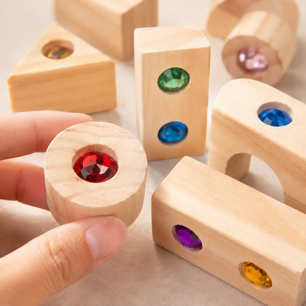Wooden gem building blocks tidied in their storage tray for shelf display