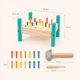 Wooden hammer and peg pounding bench size guide showing dimensions of the bench, 14 colored pegs, hammer, and punch tool in centimeters