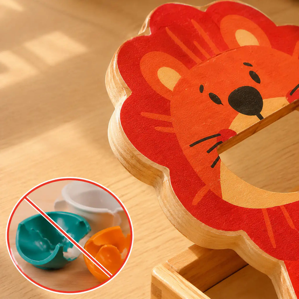 Close-up of the wooden lion figure, color-matching cups and smooth sanded wooden balls