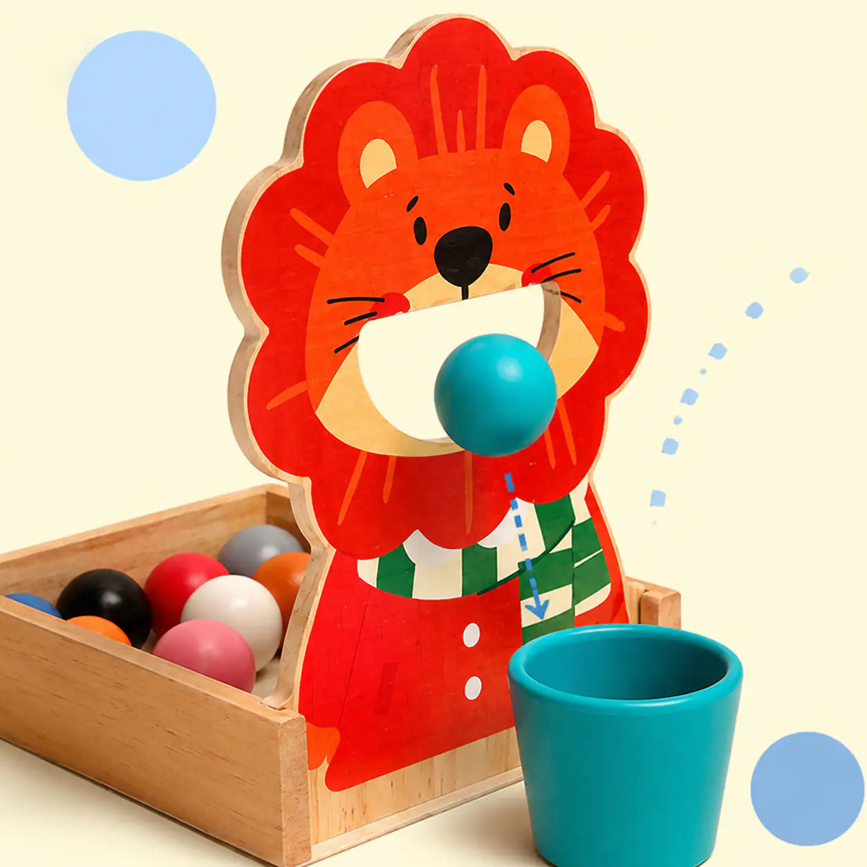 Wooden scoop transferring colored balls into matching cups on the lion color sorter