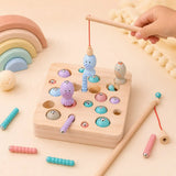 Wooden magnetic fishing rod catching a pastel fish from the natural wood game board