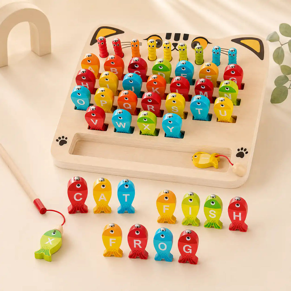 Wooden alphabet fish spelling CAT, FISH, and FROG on the magnetic fishing board