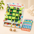 Wooden memory game board showing the printed Memory Game title, sliding green tiles, scoring tracks, and a full stack of picture cards