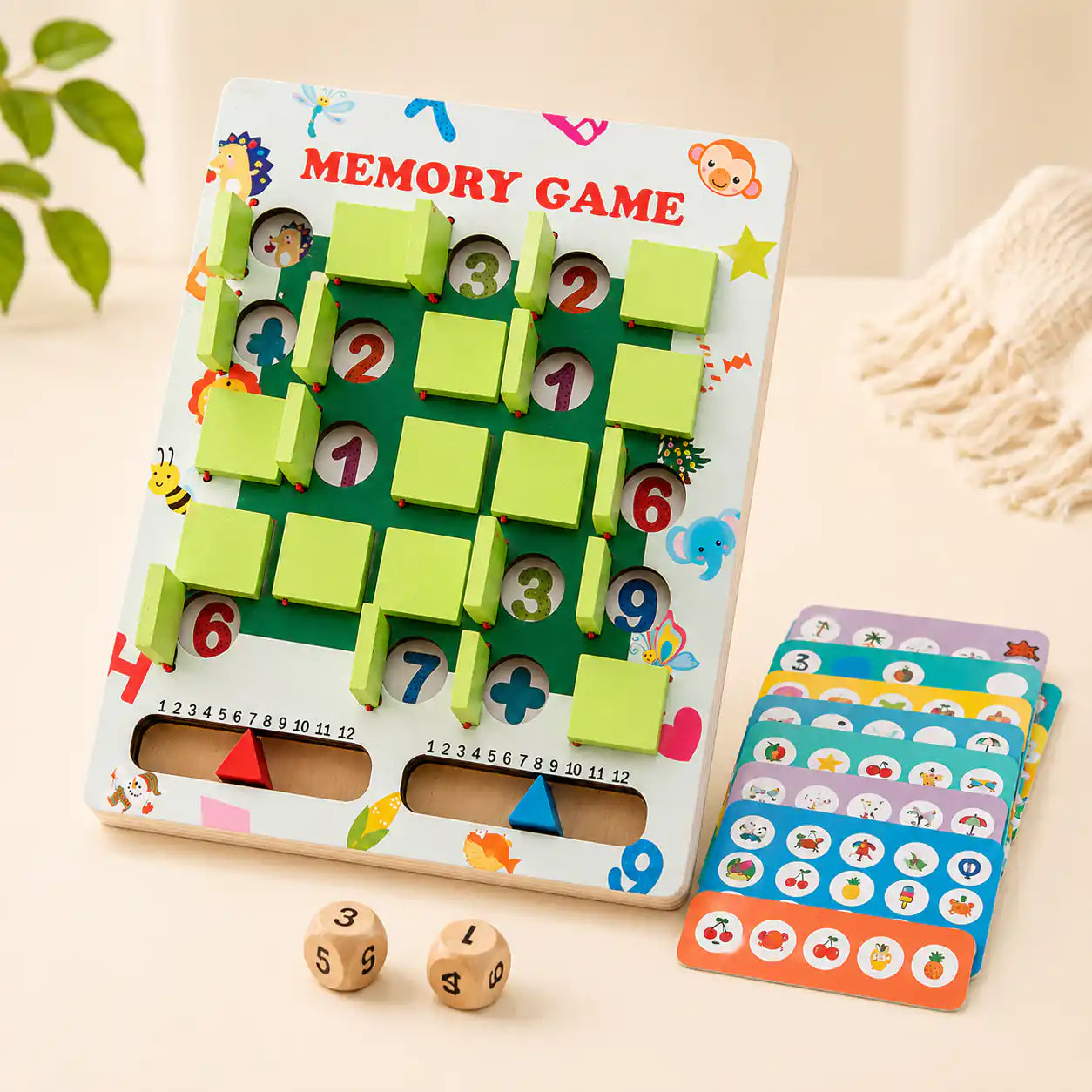 Wooden memory game board showing the printed Memory Game title, sliding green tiles, scoring tracks, and a full stack of picture cards