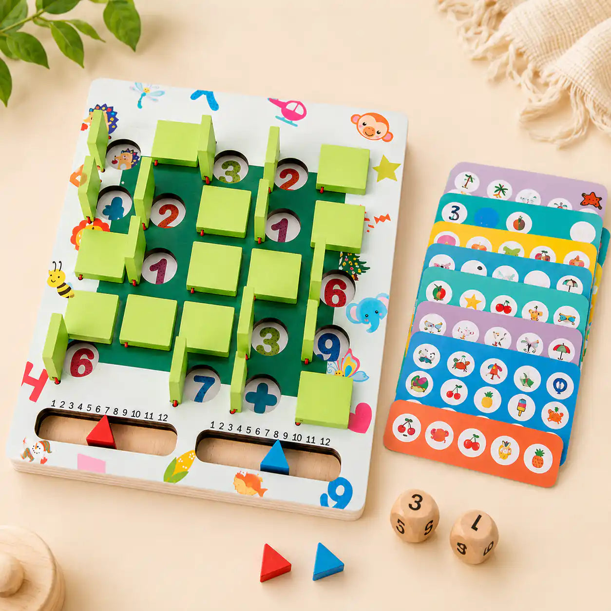 Wooden memory game board with sliding tiles, red and blue triangle scoring markers, picture cards, and two number dice