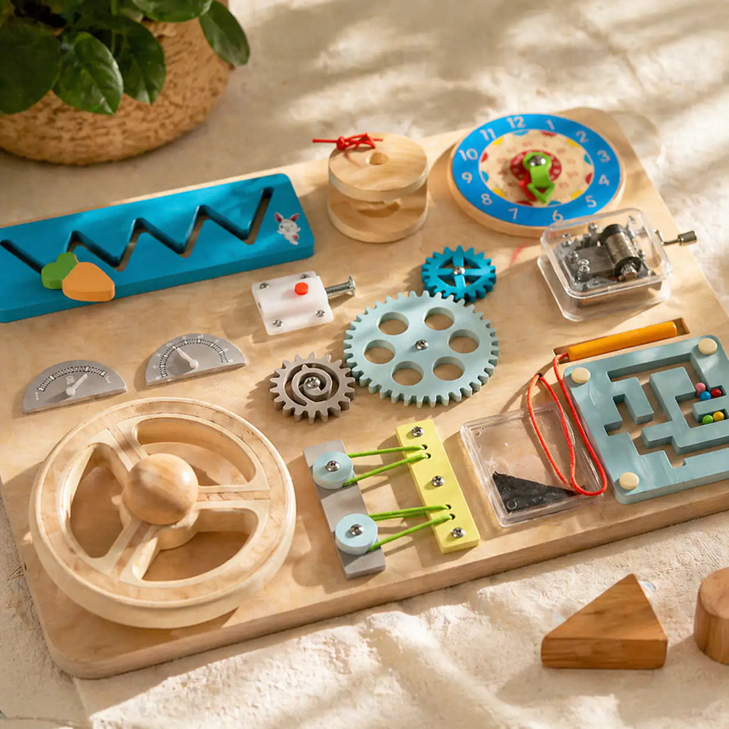 Wooden Montessori busy board styled on a warm, curated playroom shelf
