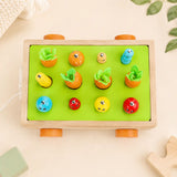 Magnetic fishing game on the Montessori harvest cart with wooden fish and caterpillars