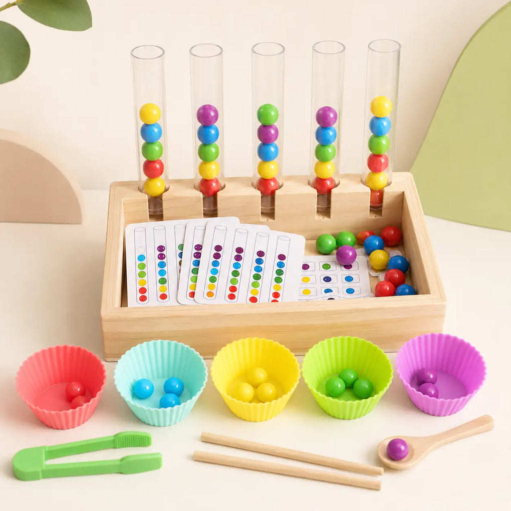 Wooden Montessori rainbow bead sorting set with five clear test tubes, rainbow beads and tools on a cream background