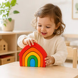 Close-up of a single wooden rainbow arch showing smooth painted finish