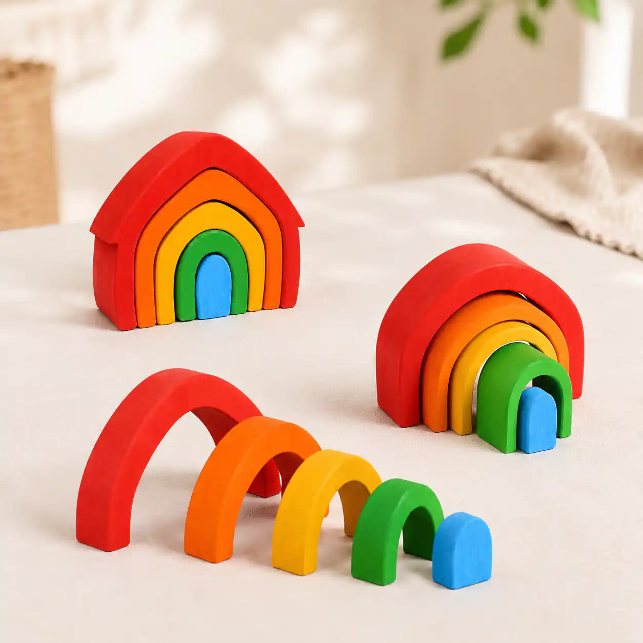 Top-down view of wooden rainbow arch stacker showing nested arch shapes