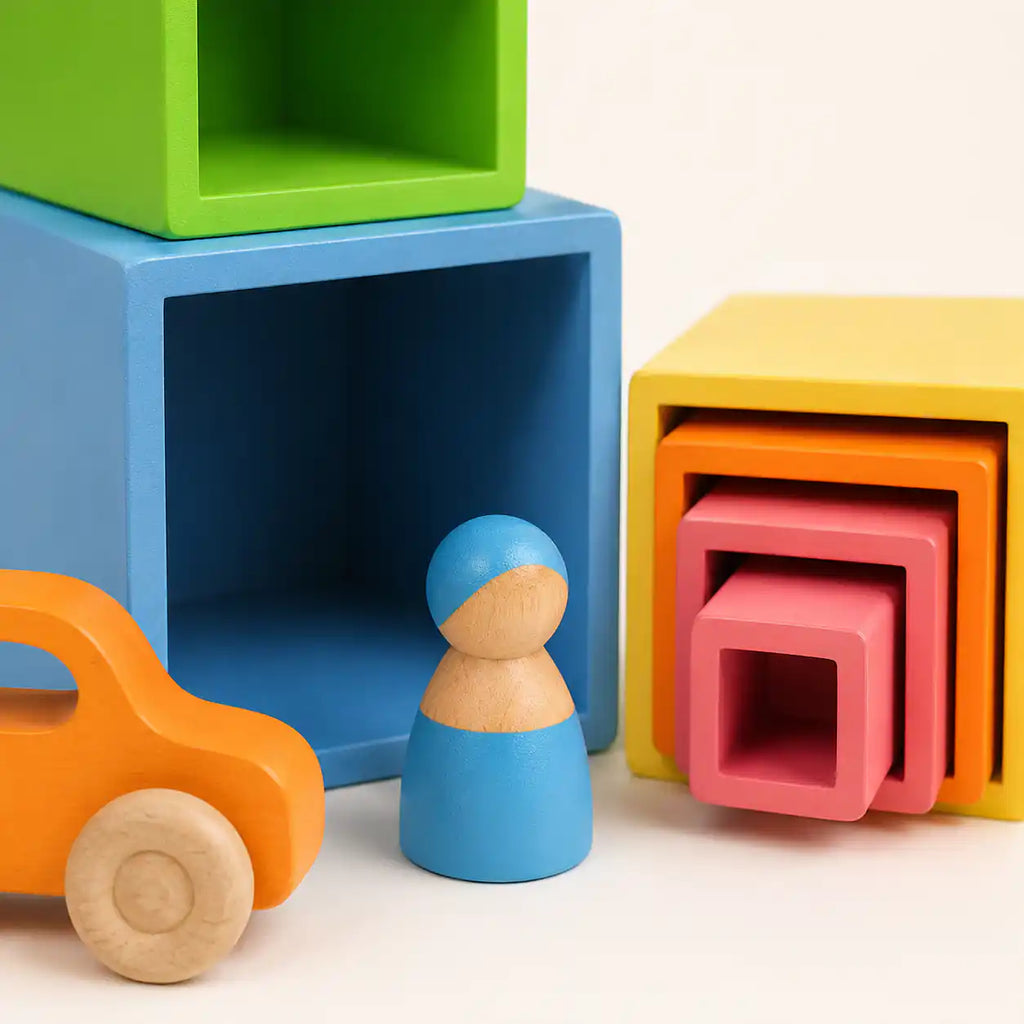 All wooden rainbow nesting cubes separated and displayed in order from largest to smallest