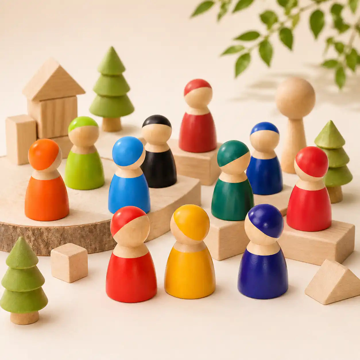 Small hands holding wooden rainbow peg doll friends on a warm neutral surface