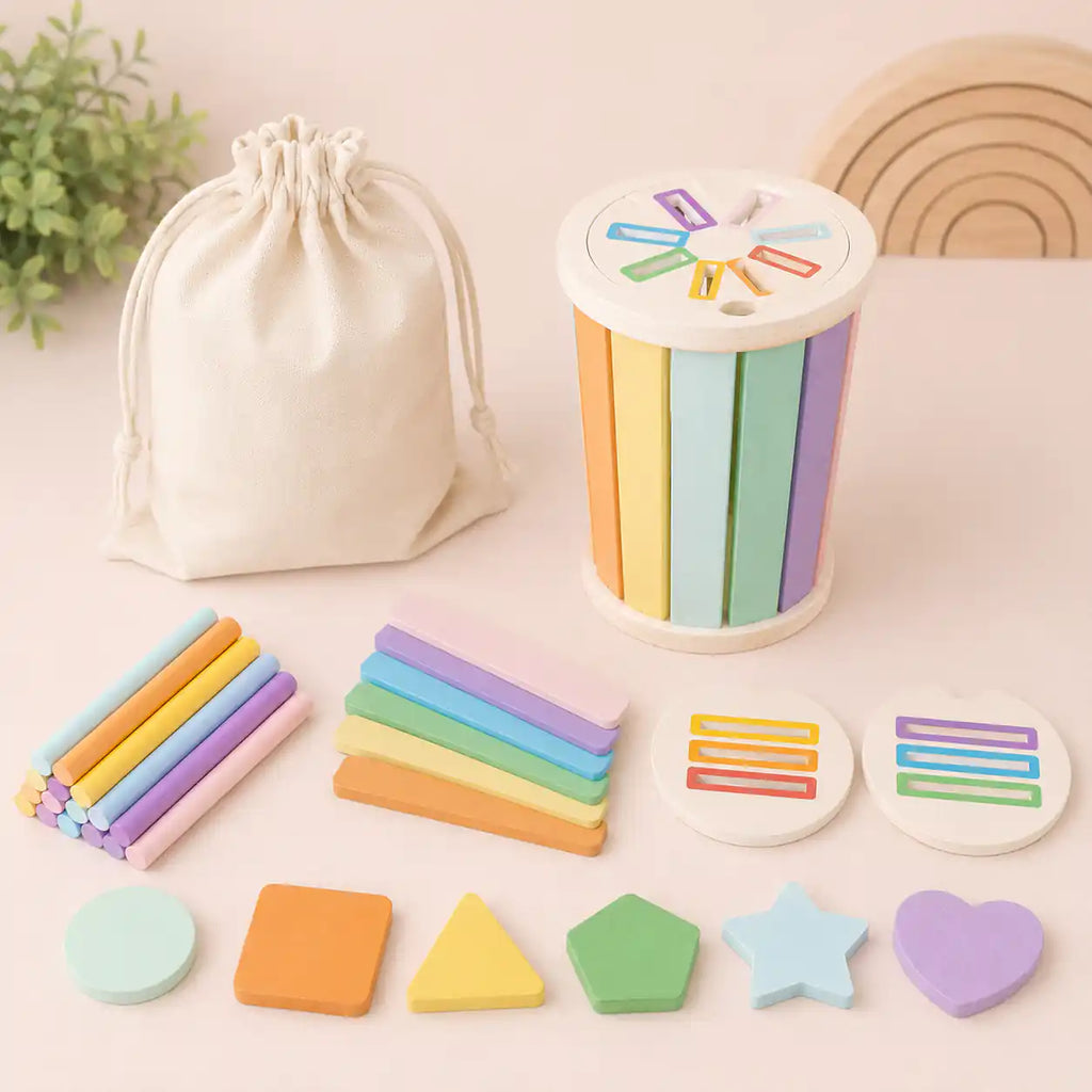 Pastel wooden Montessori sorting cylinder set with shape pieces and colored sticks styled on a soft neutral surface