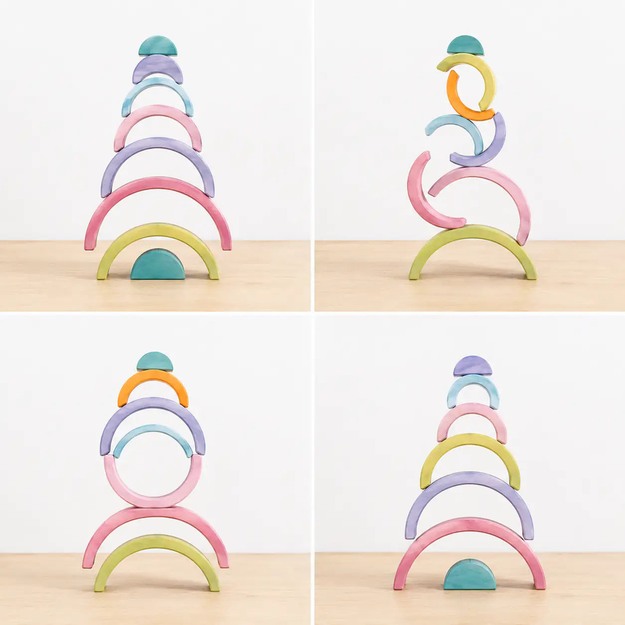Macaron pastel rainbow stacker pieces balanced into a stacked tower showing fine motor and stacking play