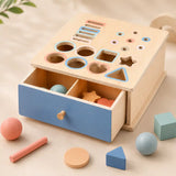 Side angle of the wooden shape sorter with open peek-a-boo drawer