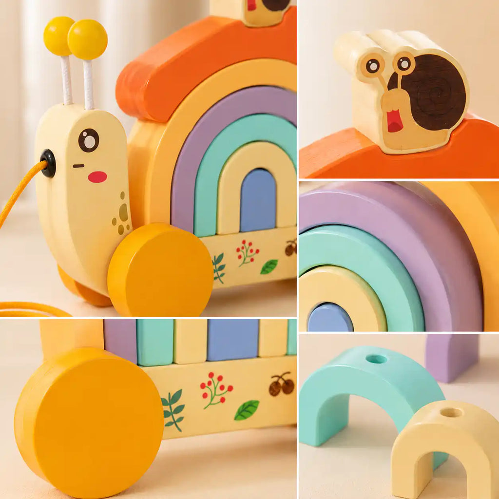 Wooden snail pull-along toy rolling on its yellow wheels with the pull string trailing behind, first walker for toddlers